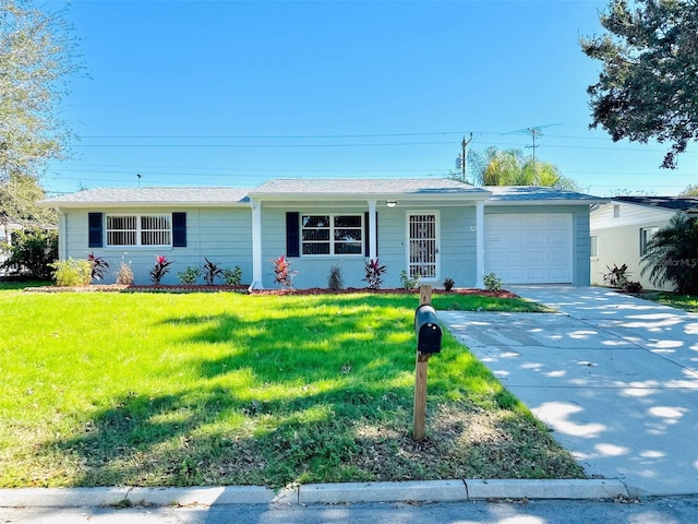 ranch-style home with a front yard and a garage