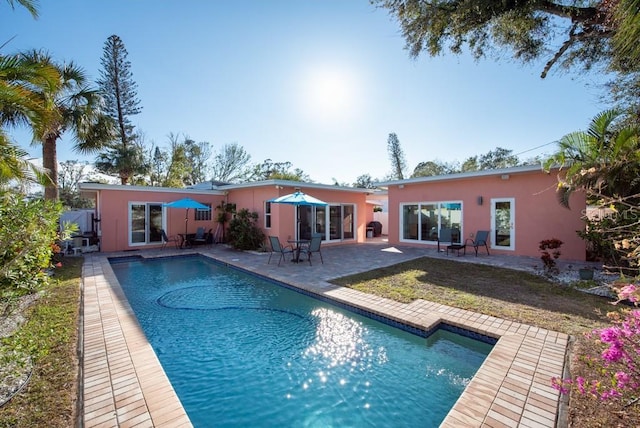 view of pool featuring a patio