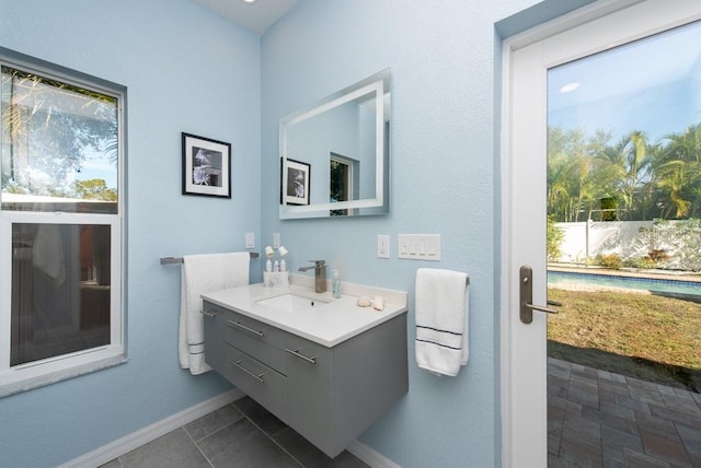 bathroom with tile patterned flooring and vanity