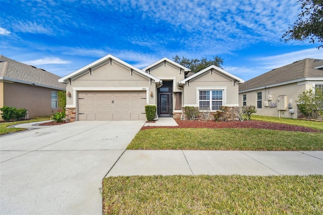 view of front of house featuring a garage and a front yard