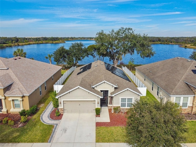 birds eye view of property with a water view