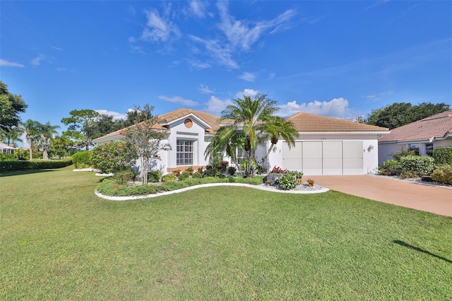 mediterranean / spanish-style home featuring a garage and a front lawn