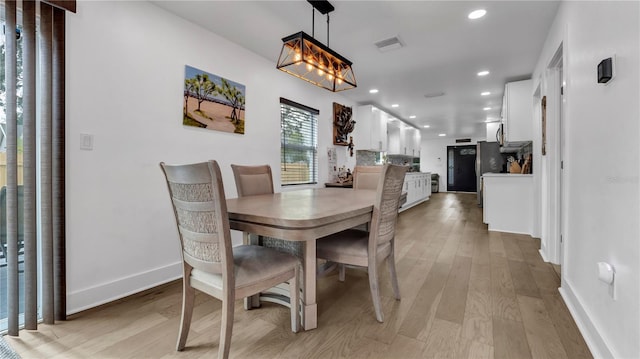 dining room with light wood-type flooring