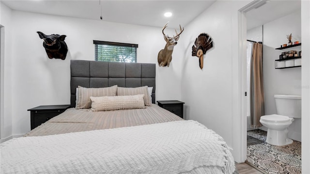 bedroom with hardwood / wood-style flooring