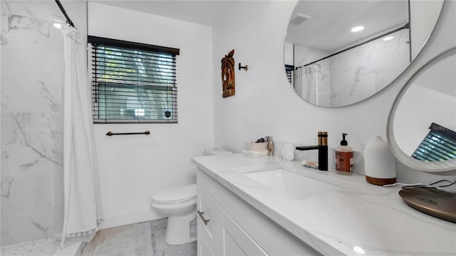 bathroom with vanity, walk in shower, and toilet