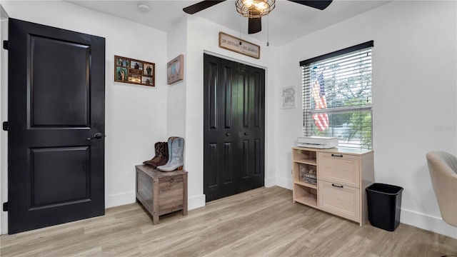 foyer featuring ceiling fan and light hardwood / wood-style flooring