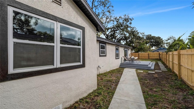 view of side of home with a deck