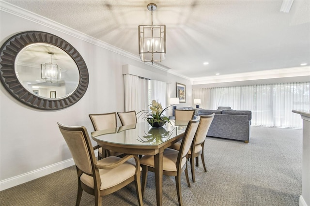 carpeted dining area with crown molding, a chandelier, and a textured ceiling