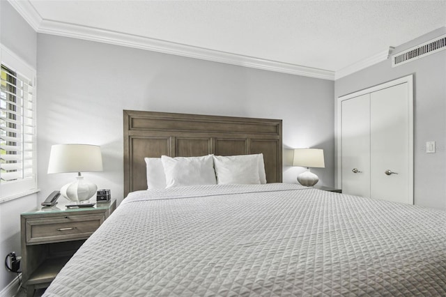 bedroom with multiple windows, a textured ceiling, a closet, and ornamental molding