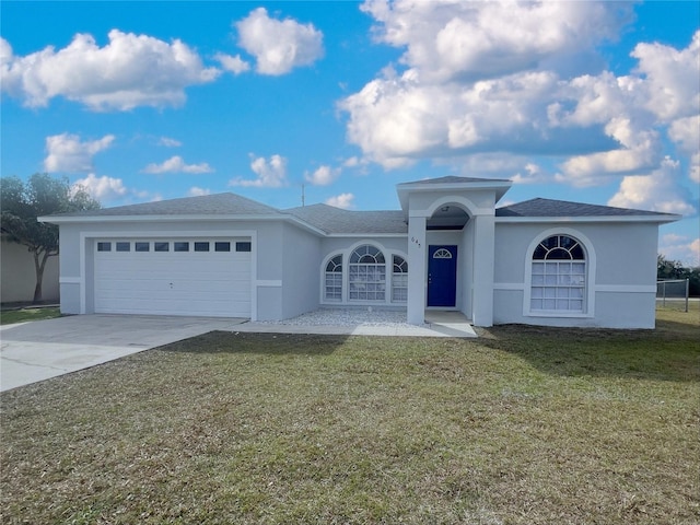 view of front of house with a garage and a front yard