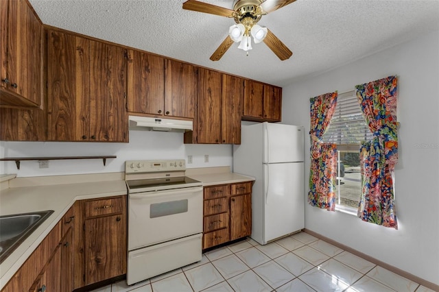 kitchen with a textured ceiling, ceiling fan, sink, and white appliances