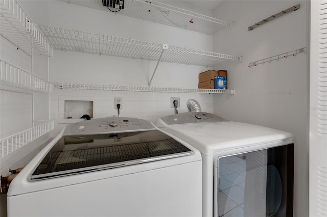 laundry area with separate washer and dryer