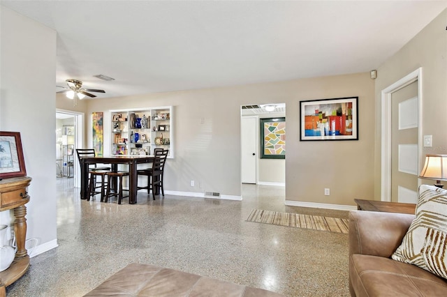 living room featuring ceiling fan