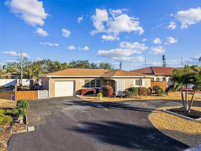 ranch-style house featuring a garage