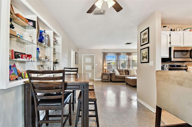 dining area with ceiling fan