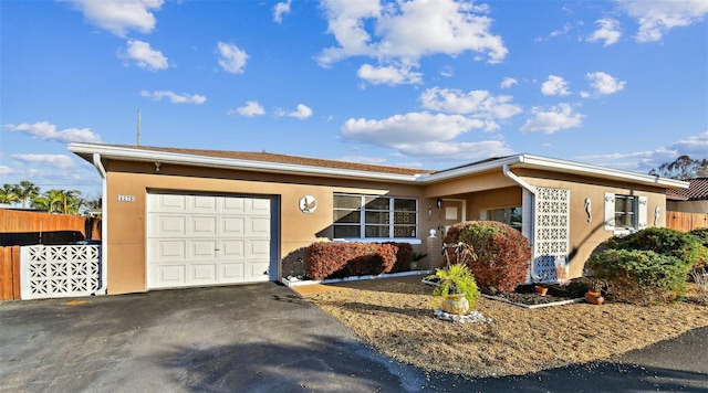 ranch-style house featuring a garage