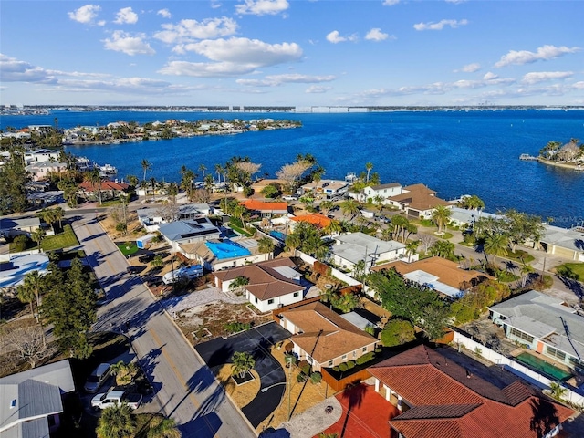 bird's eye view featuring a water view and a residential view