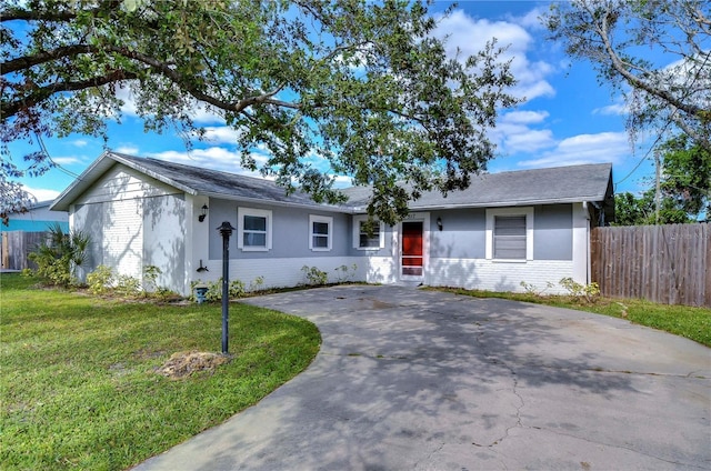 ranch-style home with a front yard