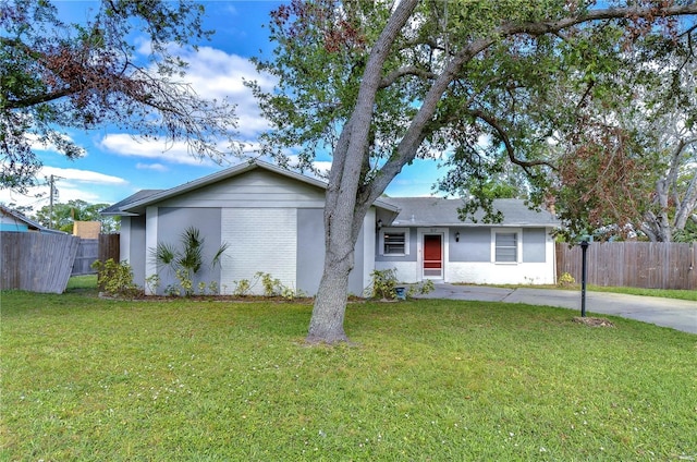 ranch-style home with a front lawn