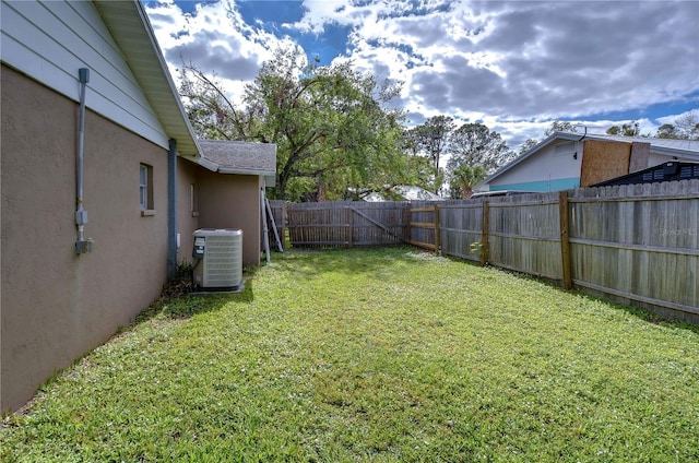 view of yard with central AC