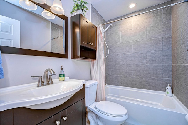 full bathroom featuring vanity, toilet, and shower / bath combo with shower curtain