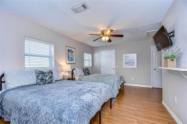 bedroom featuring ceiling fan and light hardwood / wood-style floors