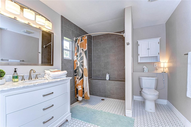 bathroom with a shower with curtain, vanity, and toilet