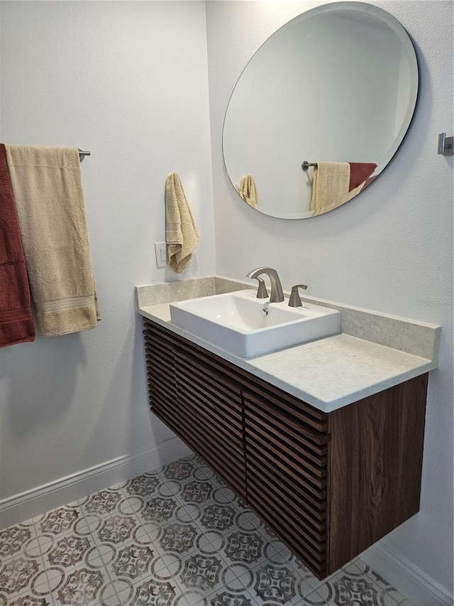 bathroom with tile patterned flooring and vanity