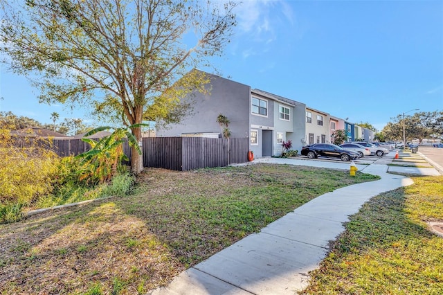 view of property exterior with a lawn