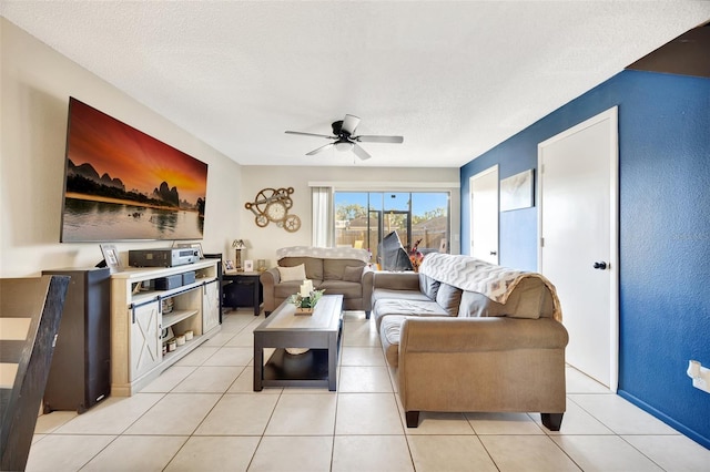 tiled living room featuring a textured ceiling and ceiling fan