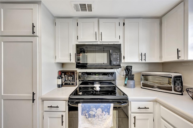 kitchen with white cabinets and black appliances