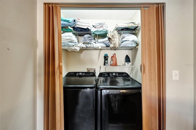 laundry room with independent washer and dryer