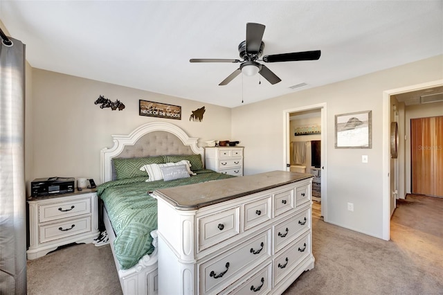 bedroom with light carpet and ceiling fan