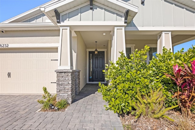 view of exterior entry featuring a garage