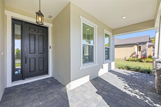 property entrance with covered porch