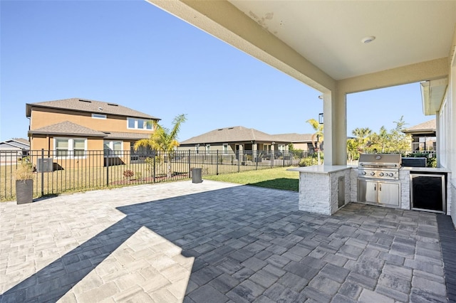 view of patio / terrace with an outdoor kitchen and grilling area