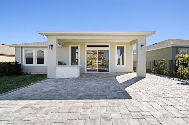 rear view of house featuring a patio area