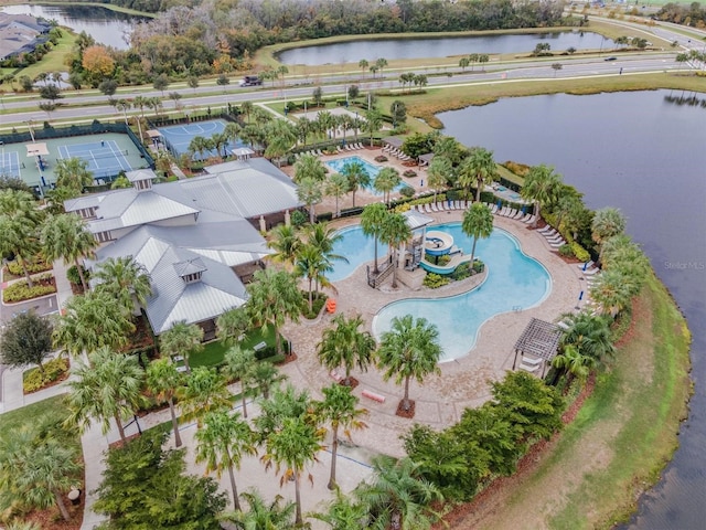 birds eye view of property with a water view