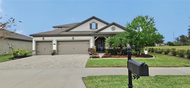 view of front facade featuring a front lawn and a garage