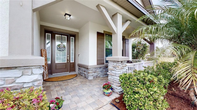 entrance to property featuring covered porch