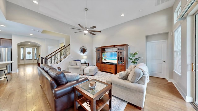 living room featuring ceiling fan and light wood-type flooring