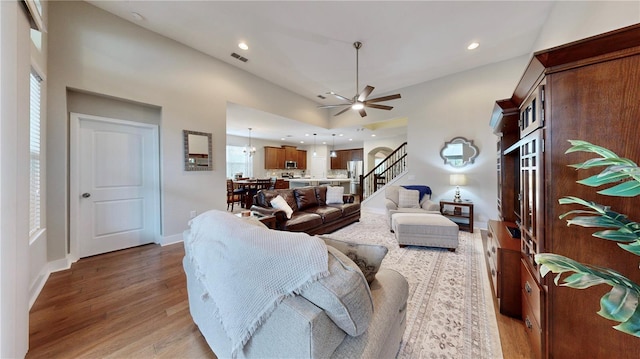 living room with ceiling fan and hardwood / wood-style floors