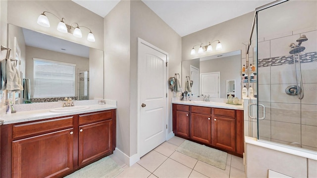 bathroom with an enclosed shower, tile patterned floors, and vanity