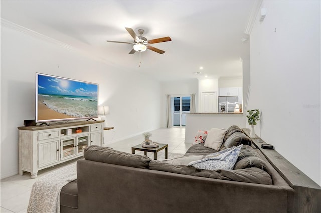 living room with crown molding, ceiling fan, and light tile patterned flooring