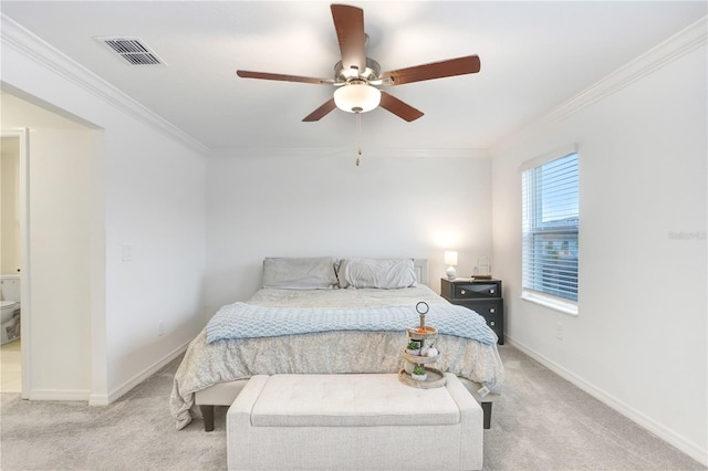 carpeted bedroom featuring crown molding, ceiling fan, and ensuite bathroom