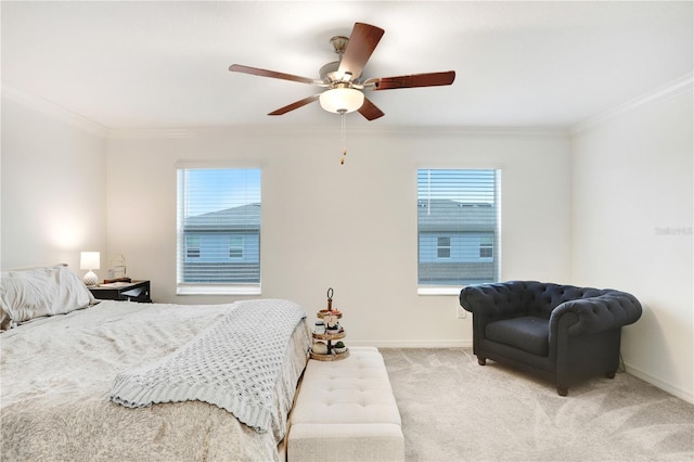 carpeted bedroom featuring crown molding and ceiling fan