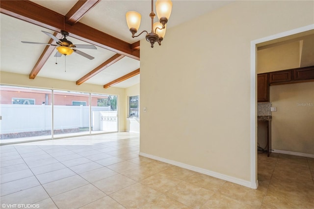 unfurnished room with ceiling fan with notable chandelier, light tile patterned floors, and lofted ceiling with beams