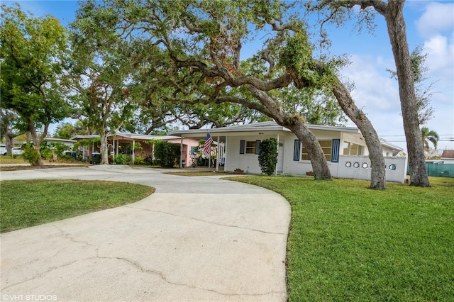 single story home featuring a front yard