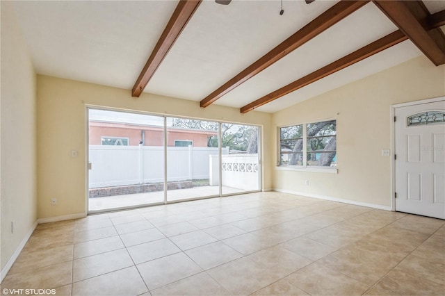 tiled spare room with lofted ceiling with beams and ceiling fan