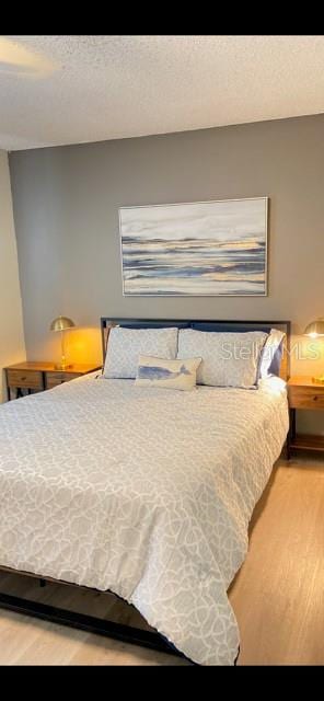 bedroom featuring hardwood / wood-style floors